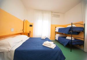 Postel nebo postele na pokoji v ubytování Hotel Montebello Riccione
