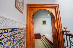 Postel nebo postele na pokoji v ubytování Riad Amely