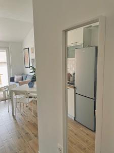 a kitchen and a living room with a refrigerator at White Truffle Pula in Marčana