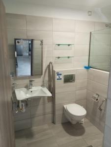 a bathroom with a toilet and a sink at Perivoli Tessa's in Parga +105 photos