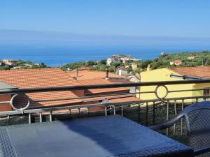 a balcony with a table and a view of the ocean at Appartamenti Miramare in Marina di Camerota