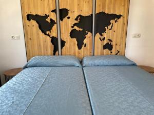 Postel nebo postele na pokoji v ubytování Hostal Roberto