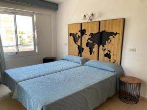 Postel nebo postele na pokoji v ubytování Hostal Roberto