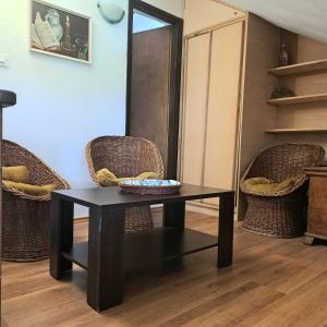 a black table and chairs in a room at Guest House Tanja in Babino Polje