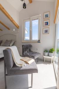 Posedenie v ubytovaní Seafront Baska Apartment + 22 fotografií