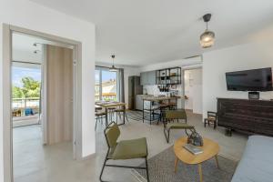 a living room with a couch and a table at La Pimpinella in Su Forti