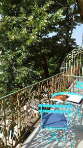 a table and chairs sitting on a balcony at Melina Studio in Timişoara