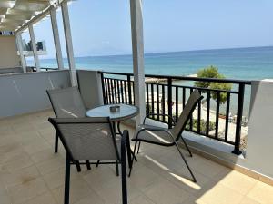 A balcony or terrace at Amaltheia Beachfront Villas