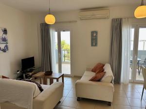 A seating area at Amaltheia Beachfront Villas