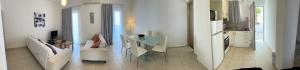 A kitchen or kitchenette at Amaltheia Beachfront Villas