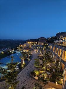 a view of a city at night with lights at Mementos by ITC Hotels, Ekaaya, Udaipur in Udaipur