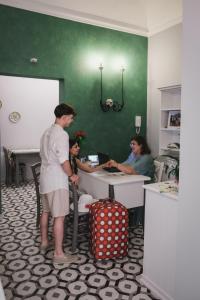 a group of people standing in a room at La Bifora e il granaio in Sciacca