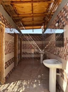a bathroom with a toilet and a sink at Sinai Life Beach Camp in Nuweiba