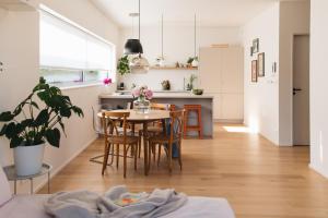 a kitchen and dining room with a table and chairs at Apartments Marinka Litomyšl in Litomyšl