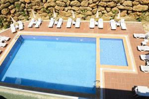 an overhead view of a swimming pool with lounge chairs at Lofts Alanya Lina in Okurcalar