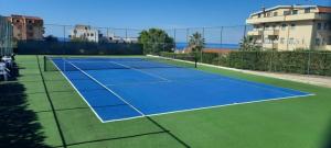 a tennis court with a tennis net on it at Panorama Residence in Scalea