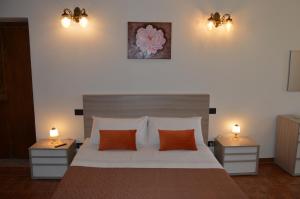 Postel nebo postele na pokoji v ubytování B&B Garden Grazia