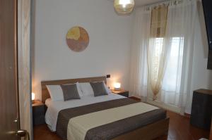 Postel nebo postele na pokoji v ubytování B&B Garden Grazia