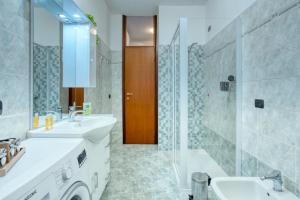 Koupelna v ubytování CaseOspitali - Casa Valza, bilocale in contesto di corte per 4 + 32 fotografií