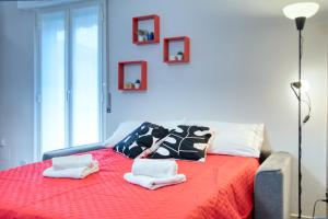 Postel nebo postele na pokoji v ubytování CaseOspitali - Casa Valza, bilocale in contesto di corte per 4