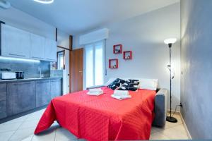 Postel nebo postele na pokoji v ubytování CaseOspitali - Casa Valza, bilocale in contesto di corte per 4