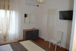 TV a/nebo společenská místnost v ubytování B&B Garden Grazia
