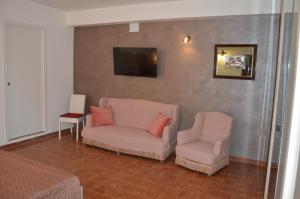 TV a/nebo společenská místnost v ubytování B&B Garden Grazia