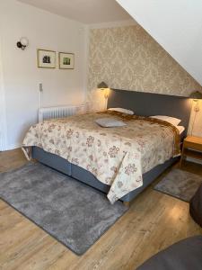 Krevet ili kreveti u jedinici u okviru objekta Hotel Højslev Kro
