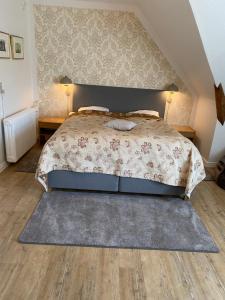 Krevet ili kreveti u jedinici u okviru objekta Hotel Højslev Kro