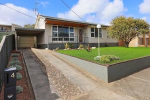 a house with a driveway in front of it at Southern Ocean Retreat in Warrnambool