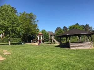 a park with a playground and a gazebo at Richtberg 2 in Plau am See