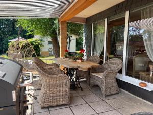 a patio with a table and chairs on a porch at Richtberg 2 in Plau am See