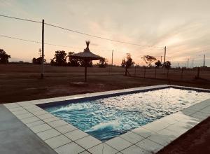 a swimming pool in a yard with an umbrella at Don Segundo in Lobos