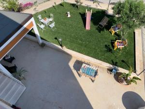 an overhead view of a backyard with a playground at Villa Maresa Home in Realmonte