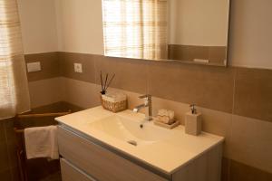 a bathroom with a sink and a mirror at Dimora Majella in Civitella Messer Raimondo
