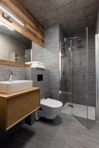 a bathroom with a toilet and a sink and a shower at XYZ eXtreme You Zen in Szczyrk
