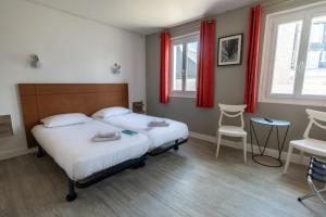 Cama ou camas em um quarto em Gite de la Baie - Morgat