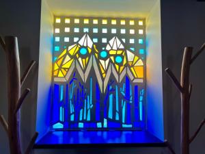 a stained glass window in a stair case at Hotel Eigón in Posada de Valdeón