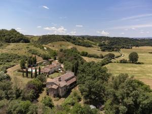 an aerial view of an old house in a field at Borgo Santa Maria in Valle in Laterina