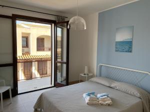 A bed or beds in a room at Aquilone Garden