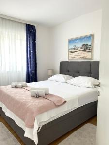 Postel nebo postele na pokoji v ubytování Beach Apartments Tina