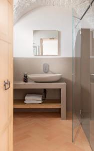 a bathroom with a sink and a mirror at Masseria Auraterrae in Polignano a Mare