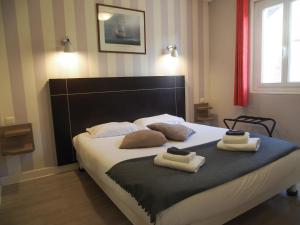 Cama ou camas em um quarto em Gite de la Baie - Morgat