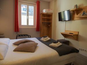 Cama ou camas em um quarto em Gite de la Baie - Morgat
