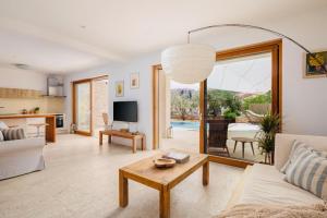 a living room with a couch and a table at Villa Fora Hvar in Hvar