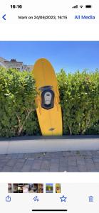 a picture of a surfboard leaned up against a hedge at Bedlam House in Newquay