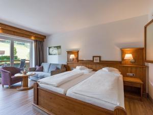 Łóżko lub łóżka w pokoju w obiekcie Hotel & Alpin Lodge Der Wastlhof