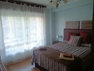 Säng eller sängar i ett rum på Apartamento Patiño en Marín