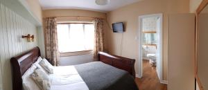 Letto o letti in una camera di The Olde Forge B & B