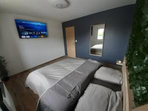 Postel nebo postele na pokoji v ubytování Lov’&Spa